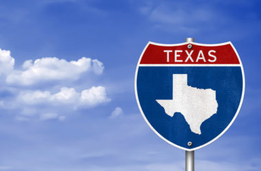 A road sign that reads Texas