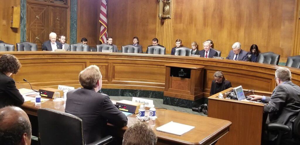 Microsoft President and chief legal officer Brad Smith testifies before a Senate subcommittee