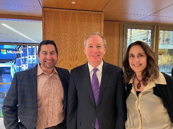 VFI Advisory Task Force leaders Ryan Risley (left) and Carol Lynn Grow (right) with Microsoft Vice Chair and President Brad Smith (center).